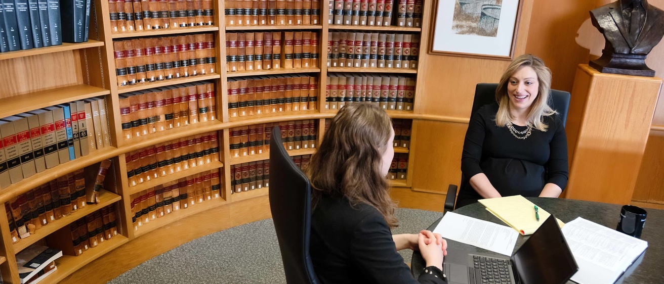 Career Advisor Melissa Norman meets with a student in the Ladd Conference Room.